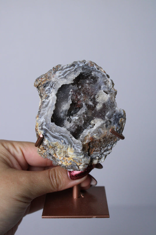 Agate geode on stand