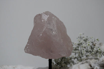 Rose quartz rough on stand