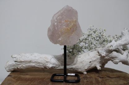 Rose quartz rough on stand