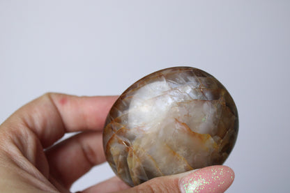 Pink moonstone palm stone